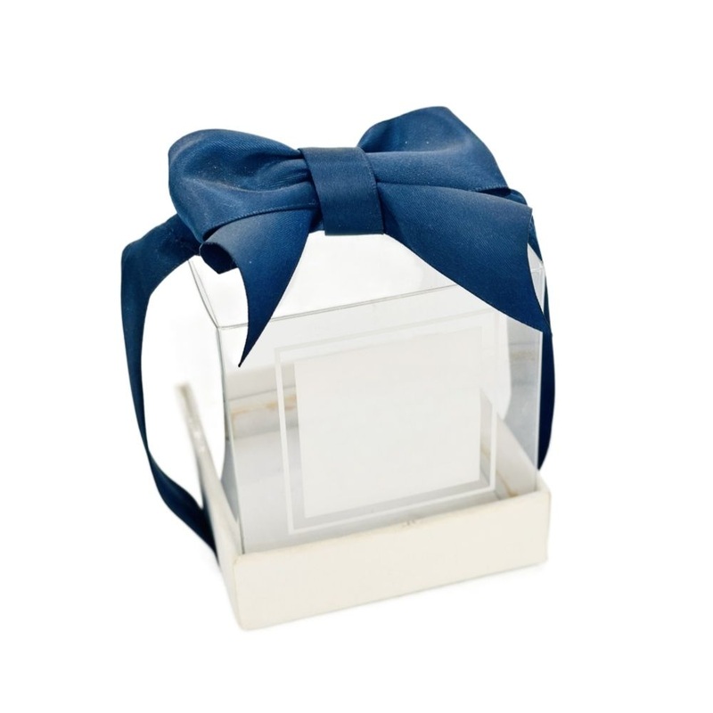 Chocolate Box Is Elegant and Unique. with a White Body, Navy – Blue Trims, and a Bow, Its Partially – Transparent Design Shows The Chocolates Inside – Premium Gift Packaging Box and Premium Chocolate Gift Packaging Box price